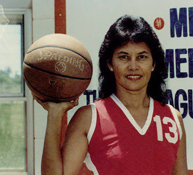 Woman holding a basketball