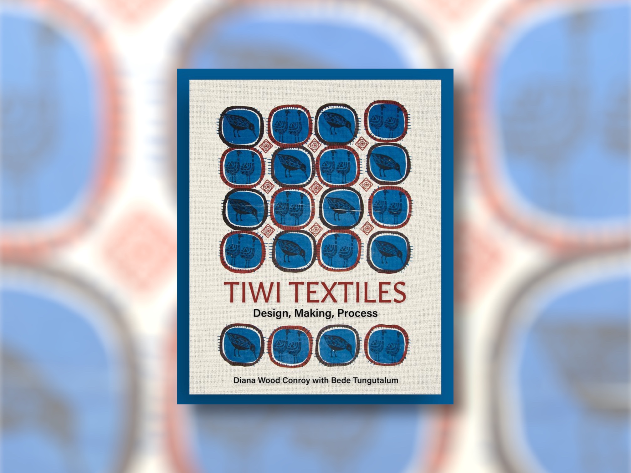 Tiwi Textiles book cover on blurred screen printed fabric background.
